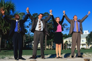 Business People Holding up Arms